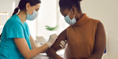 Image of woman receiving vaccination.