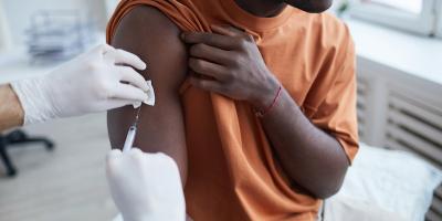 Image of man receiving vaccine
